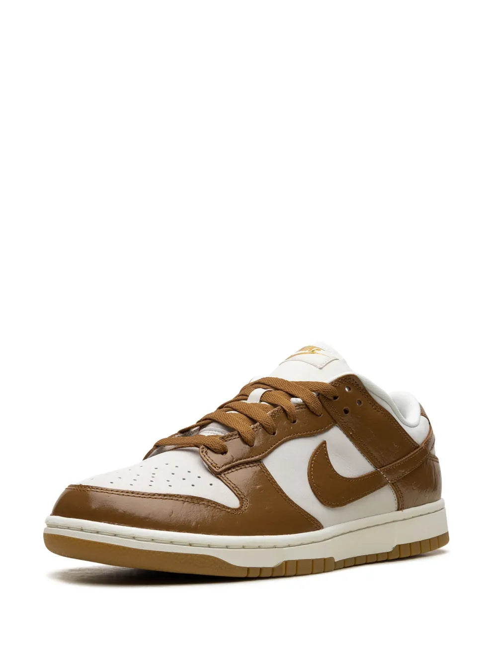 Low-top sneakers quarter view with white leather, brown swoosh, and tan laces