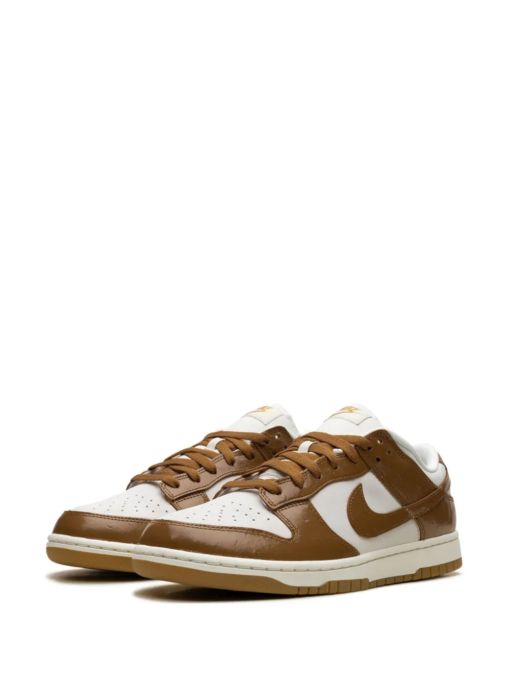 Low-top sneakers front view, white base with brown overlays and tan lace-up