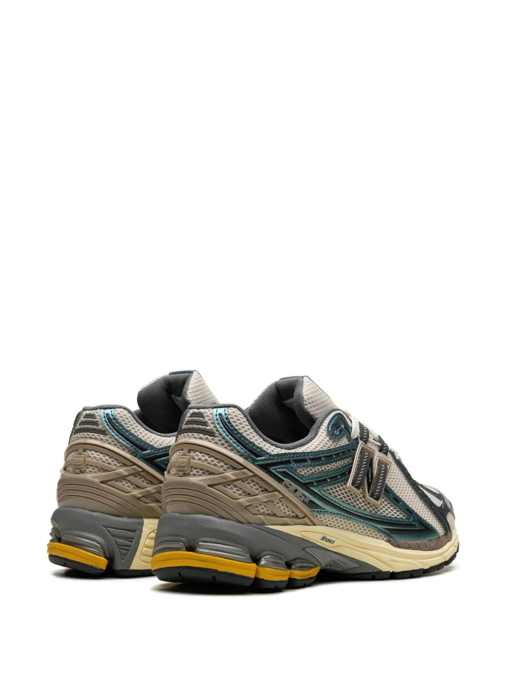 New Balance 1906R sneakers, heel and side profile in white, teal, and beige with N logo