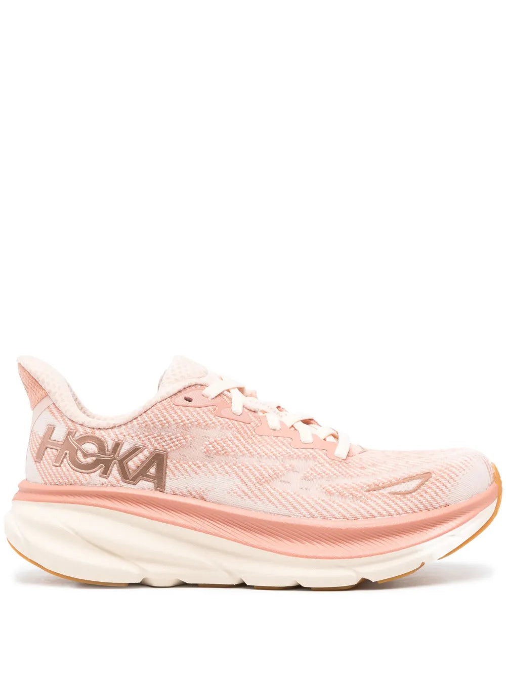 Peach HOKA running shoe with white laces and textured mesh upper