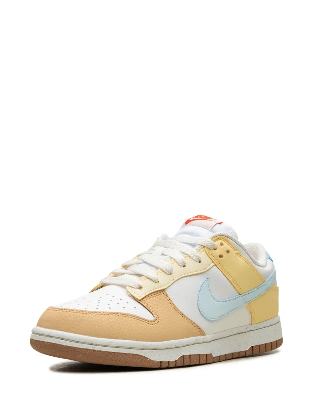 Nike Dunk Low sneaker front view in white with tan panels and light-blue swoosh, gum