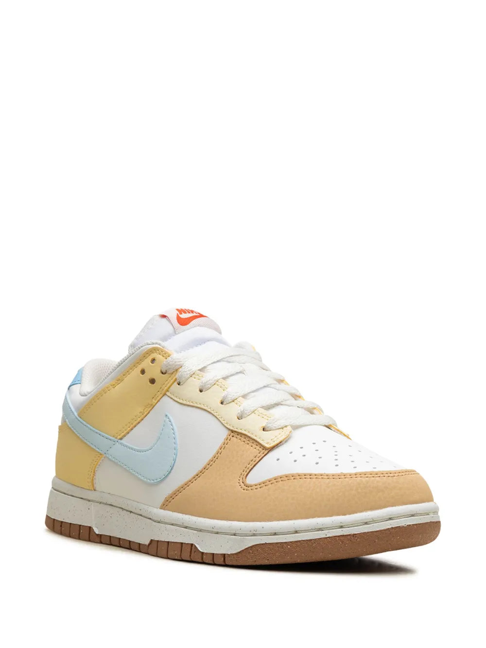 Nike Dunk Low sneaker in white leather with tan and light-blue overlays, gum sole