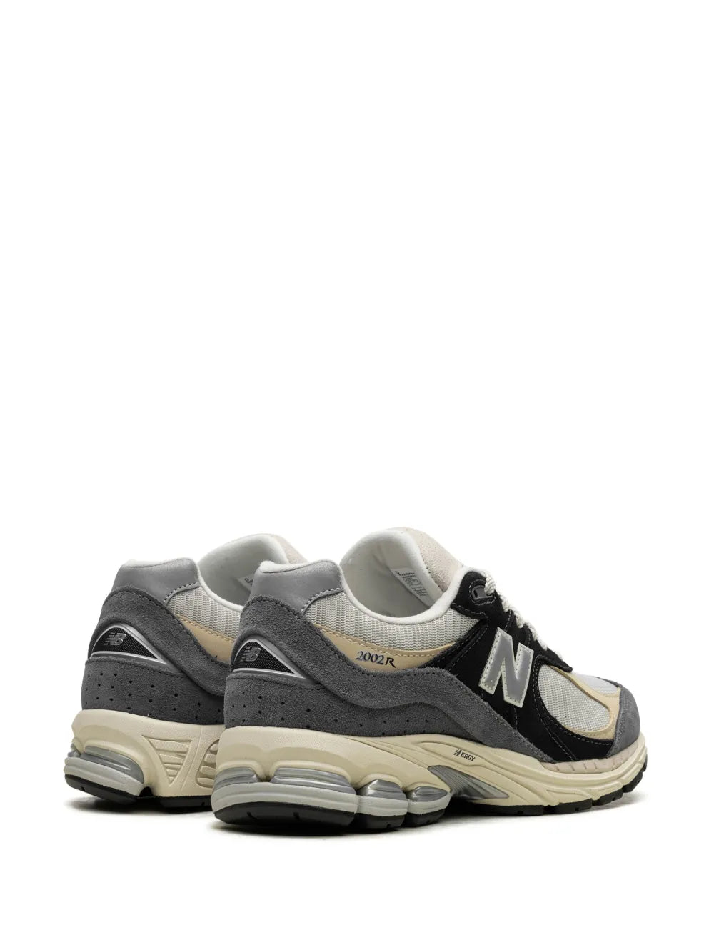 Suede running sneaker heel profile in gray and cream with black accents and N logo