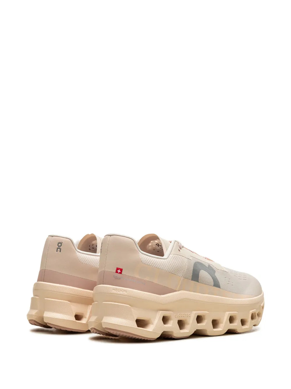 On Cloudmonster sneaker in light beige with pink collar lining and thick foam sole