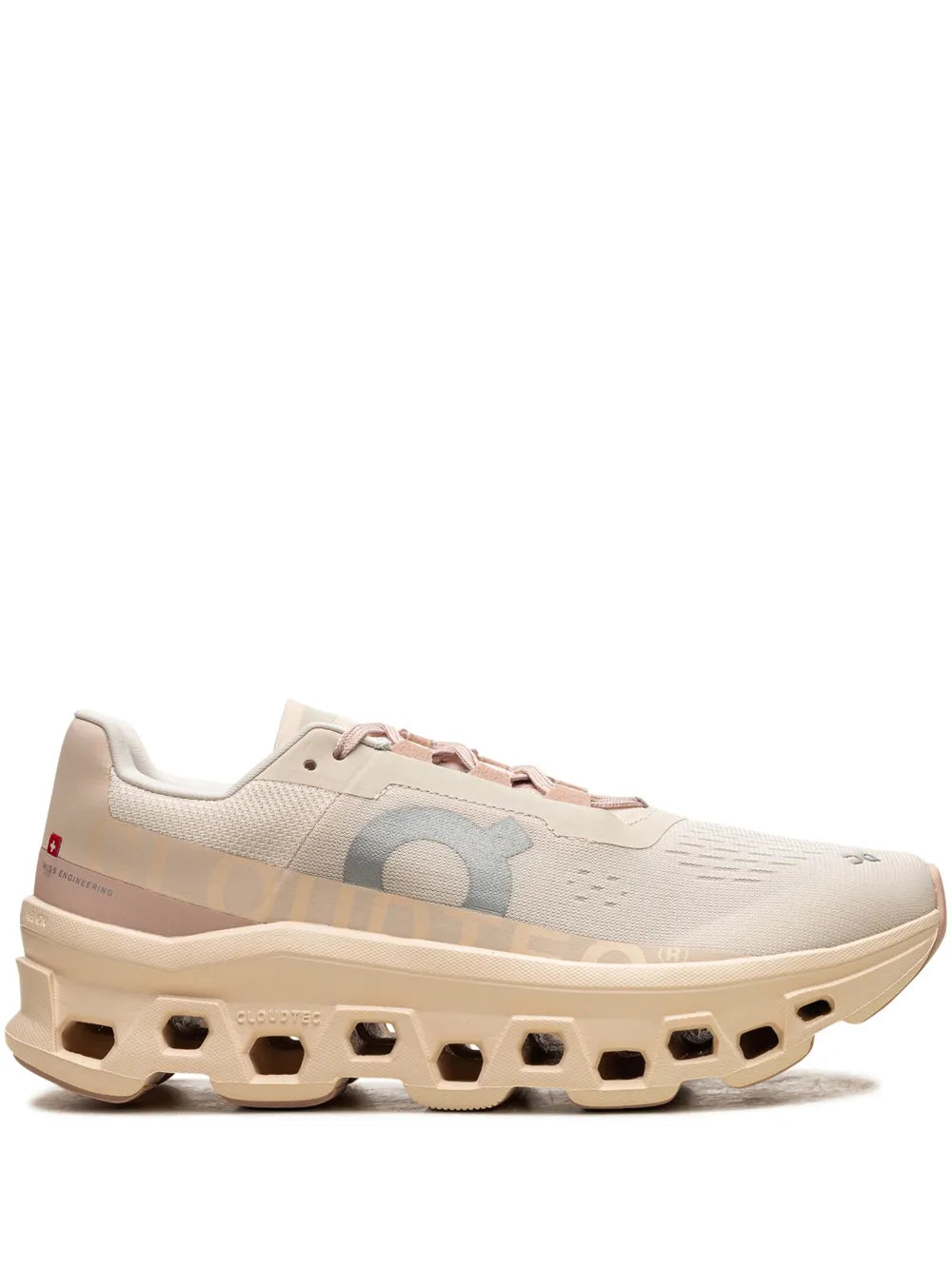 Light beige On Cloudmonster running sneaker with pink lace accents and cushioned sole