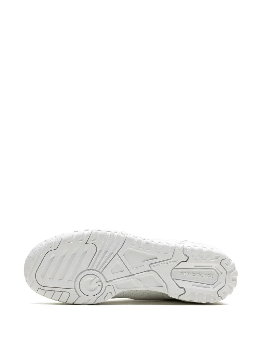 White sneaker outsole with textured rubber tread and logo markings