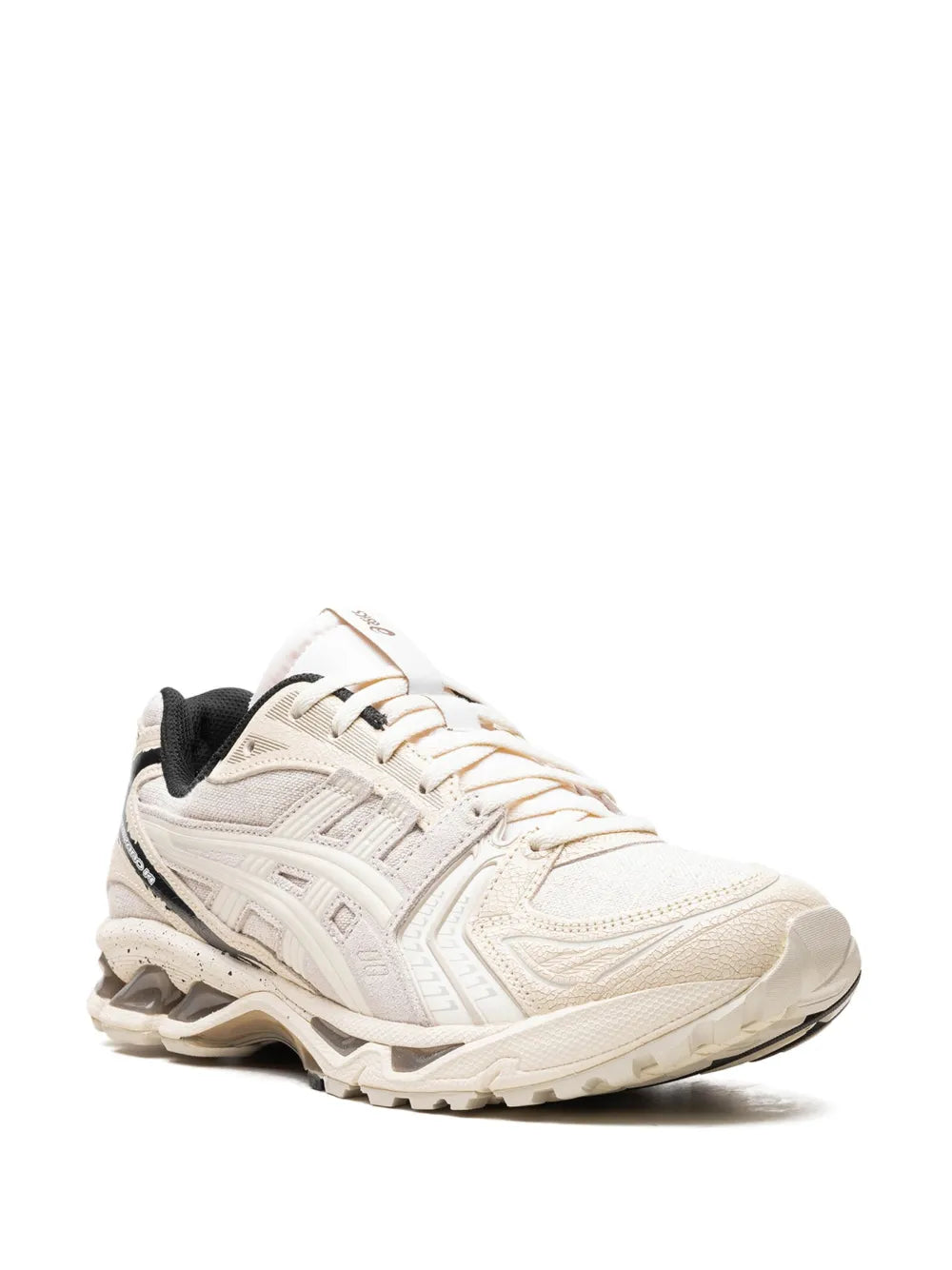 Asics Gel-Kayano 14 sneakers, white upper with black collar, lace-up side view