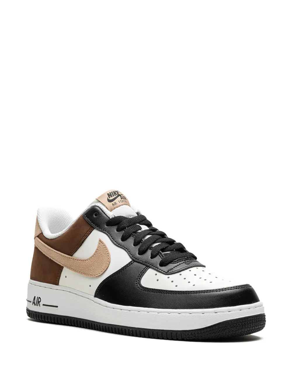 Low-top sneakers in brown, black, and white with lace-up and tan swoosh