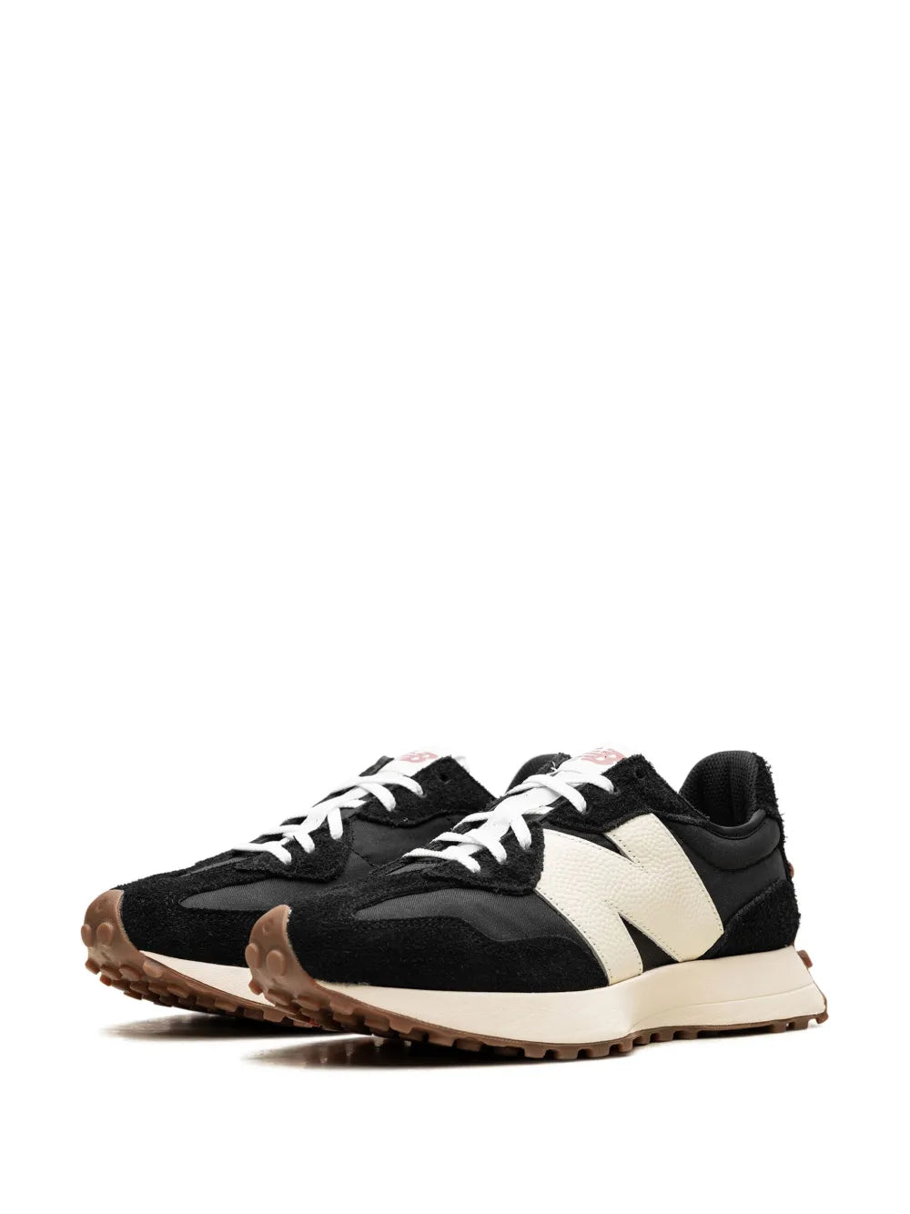 Pair of low-top sneakers, black uppers with cream/white overlays and gum outsole