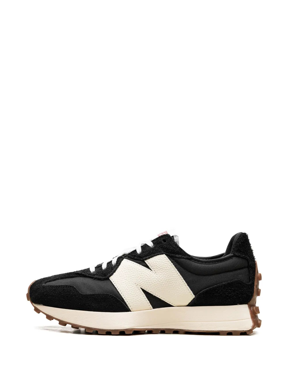 Low-top sneakers side view in black with cream/white stripe and gum sole