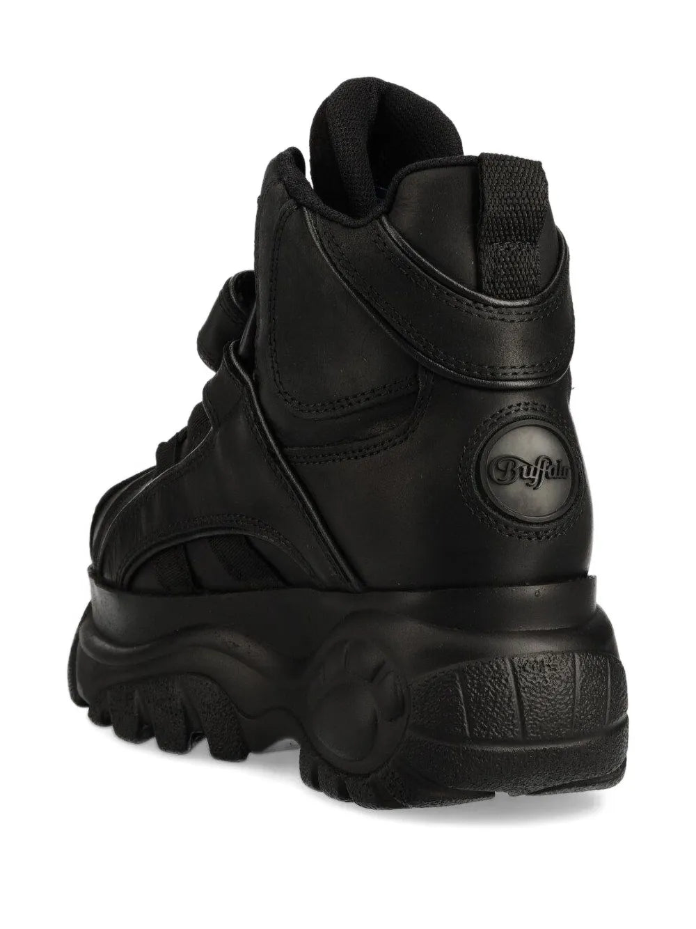 Black high-top chunky boots with round logo badge and thick tread sole