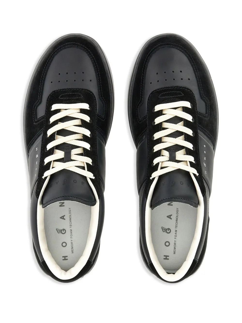 Black low-top sneaker pair with off-white laces and Hogan H logo on insole