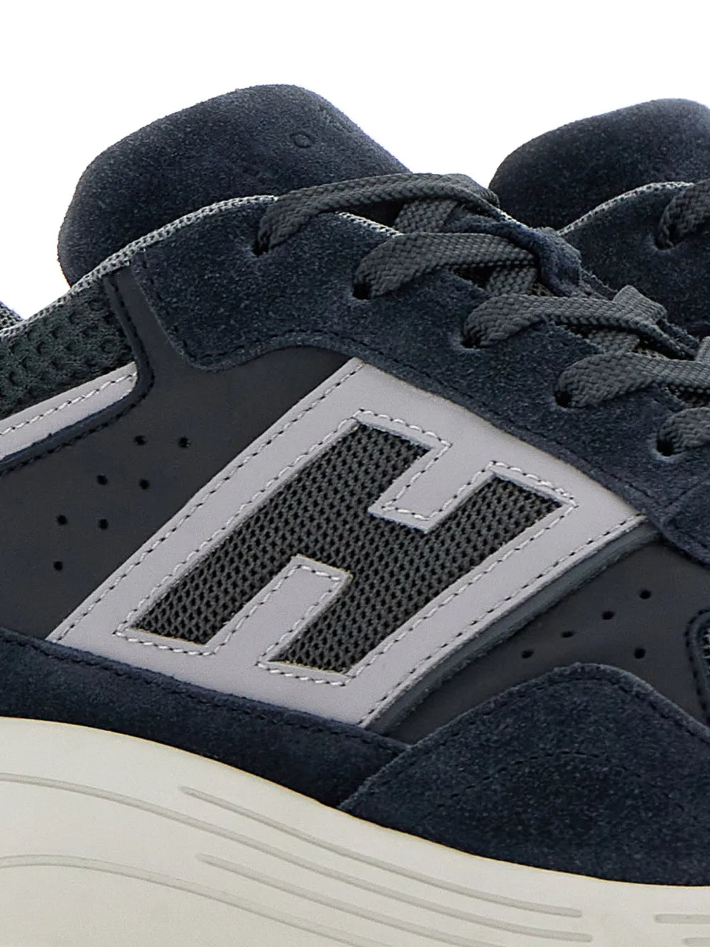 Hogan Hyperlight low-top sneakers close-up, dark navy upper with white H patch