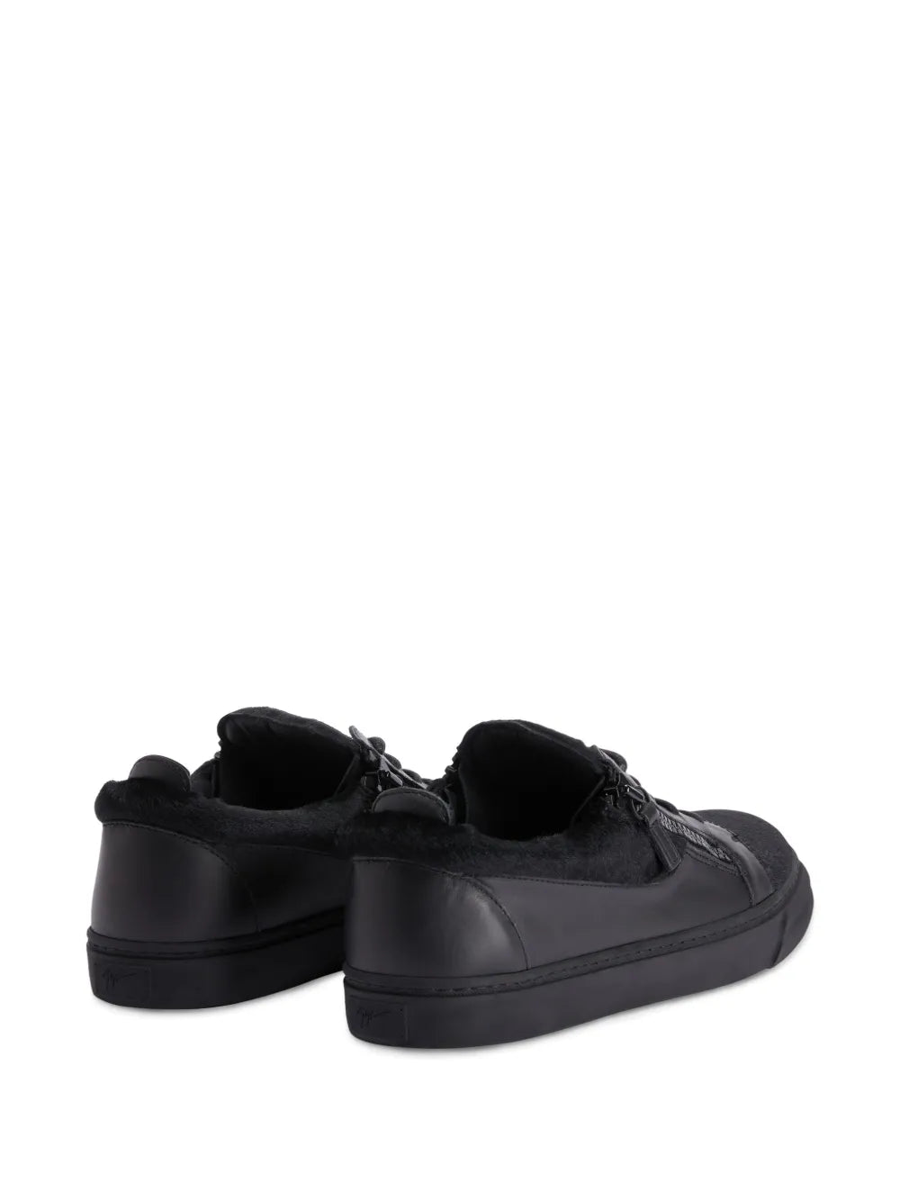 Black low-top sneakers back view with lace-up, side double zippers, flat heel