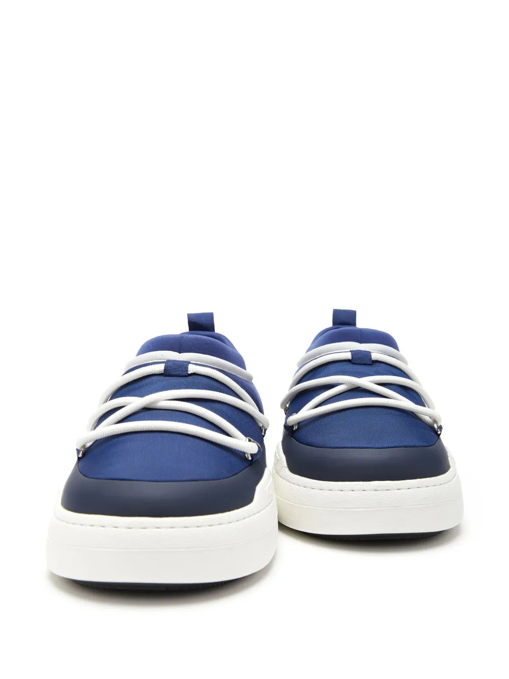 Navy blue sneakers with white laces, smooth cap toe, and cushioned collar