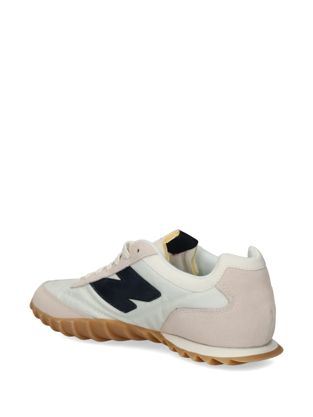New Balance RC30 sneakers with cream uppers, navy heel panel, and gum sole