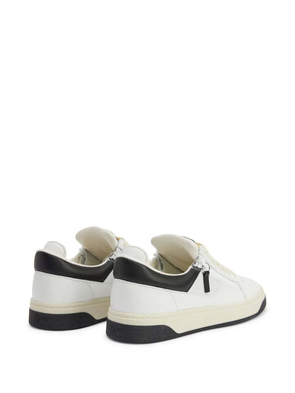 Off-white low-top sneakers with black heel counter and side zip detail
