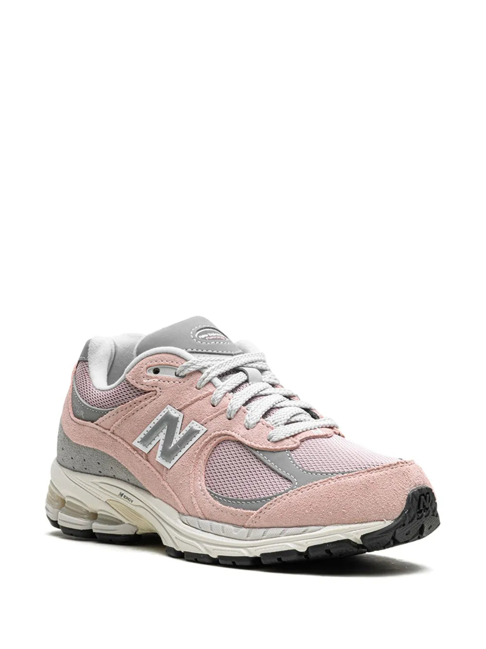Light pink New Balance 2002R sneakers, side view with lace-up eyelets and N logo