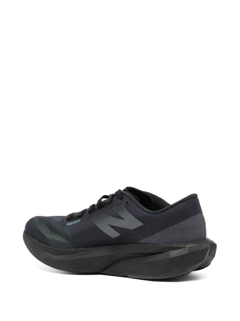 New Balance lace-up sneakers, side view of dark upper with black sculpted sole