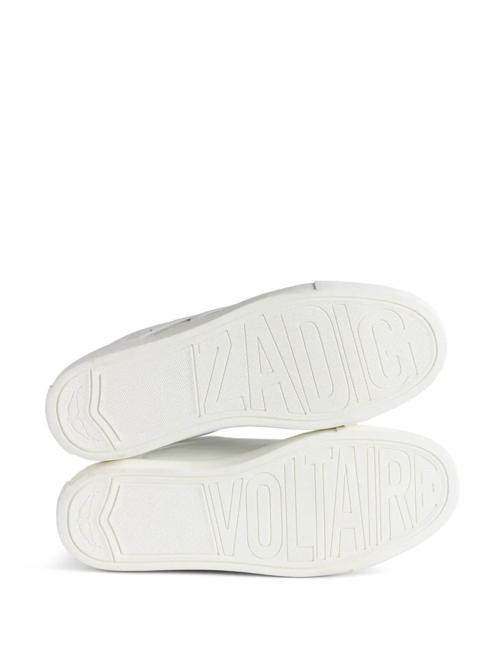 Low-top sneaker outsoles in white with tread pattern