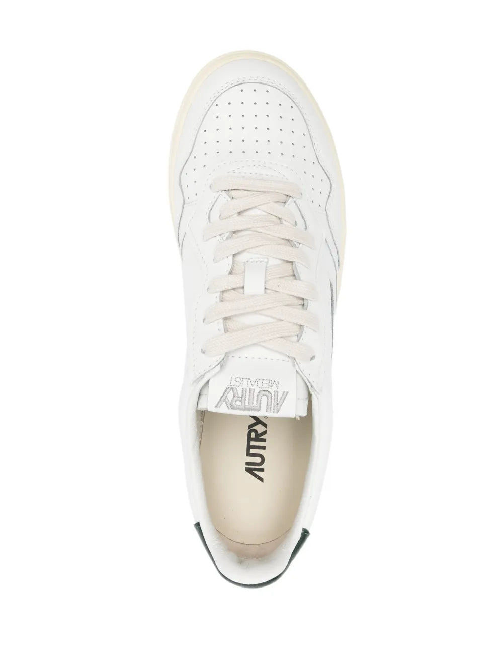 White leather sneaker with lace-up front and Autry logo visible on insole