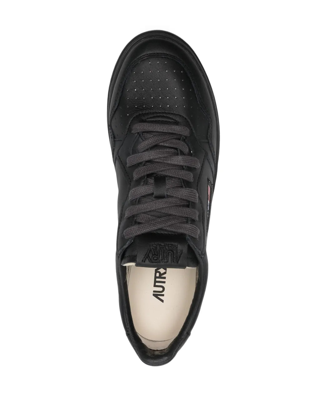 Autry black lace-up sneakers with perforated toe and tongue logo label.