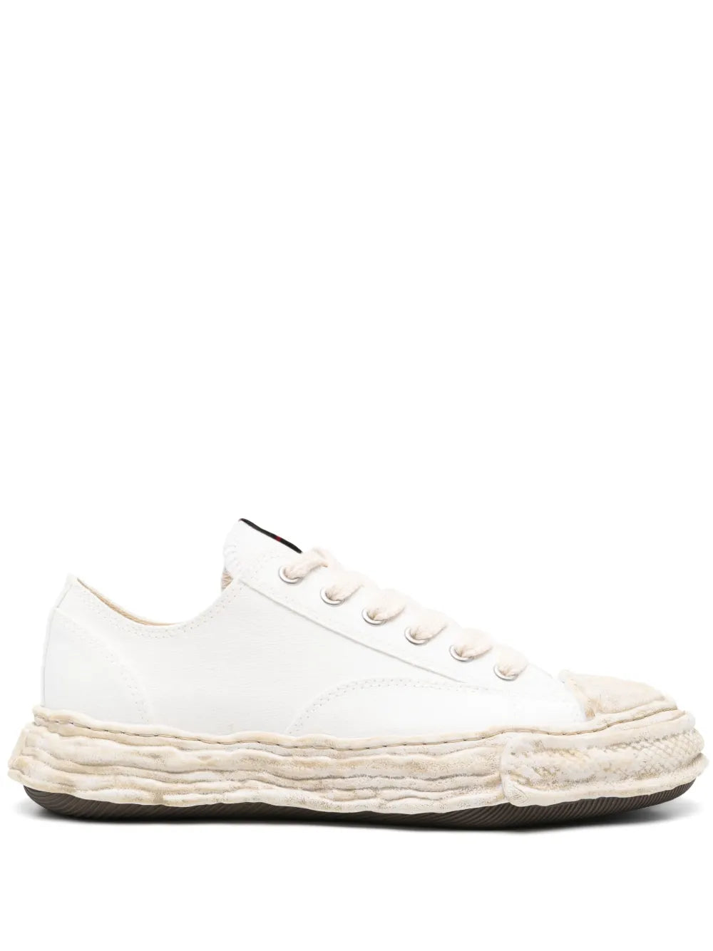 White low-top lace-up sneakers with textured midsole and rubber outsole