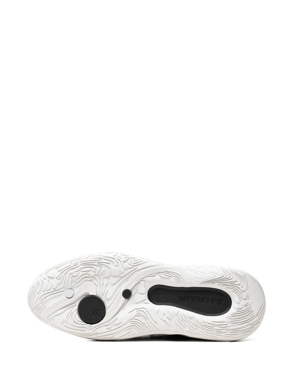 Black sneaker outsole with wavy tread pattern and white rubber sole edge