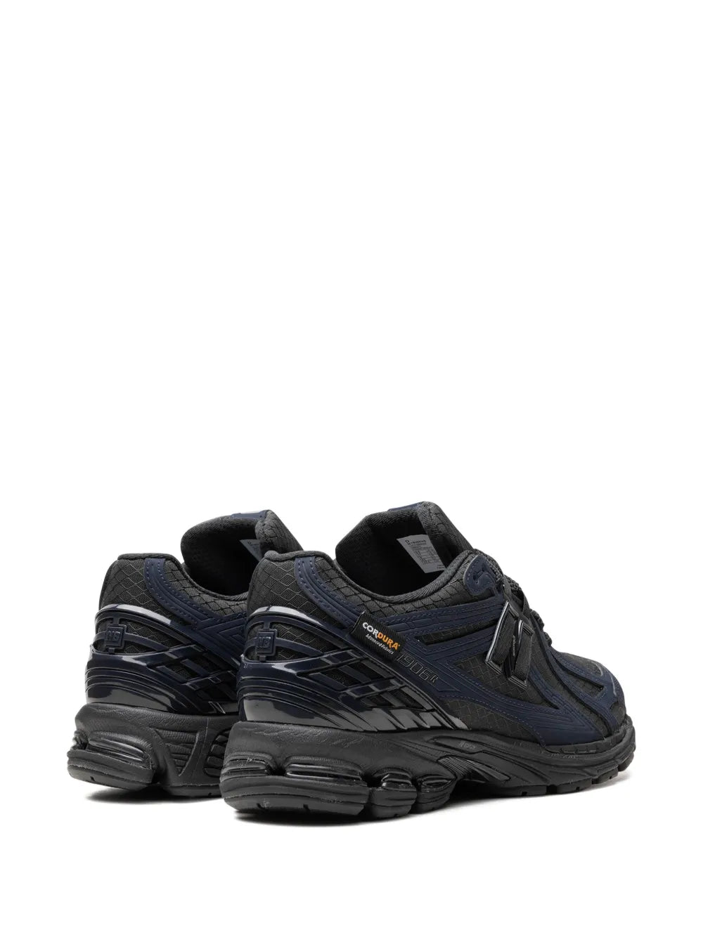 New Balance 1906R sneakers showing heel and side panels, chunky black midsole