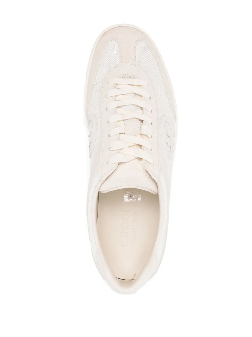 White Gucci low-top sneakers with lace-up front and open toe view