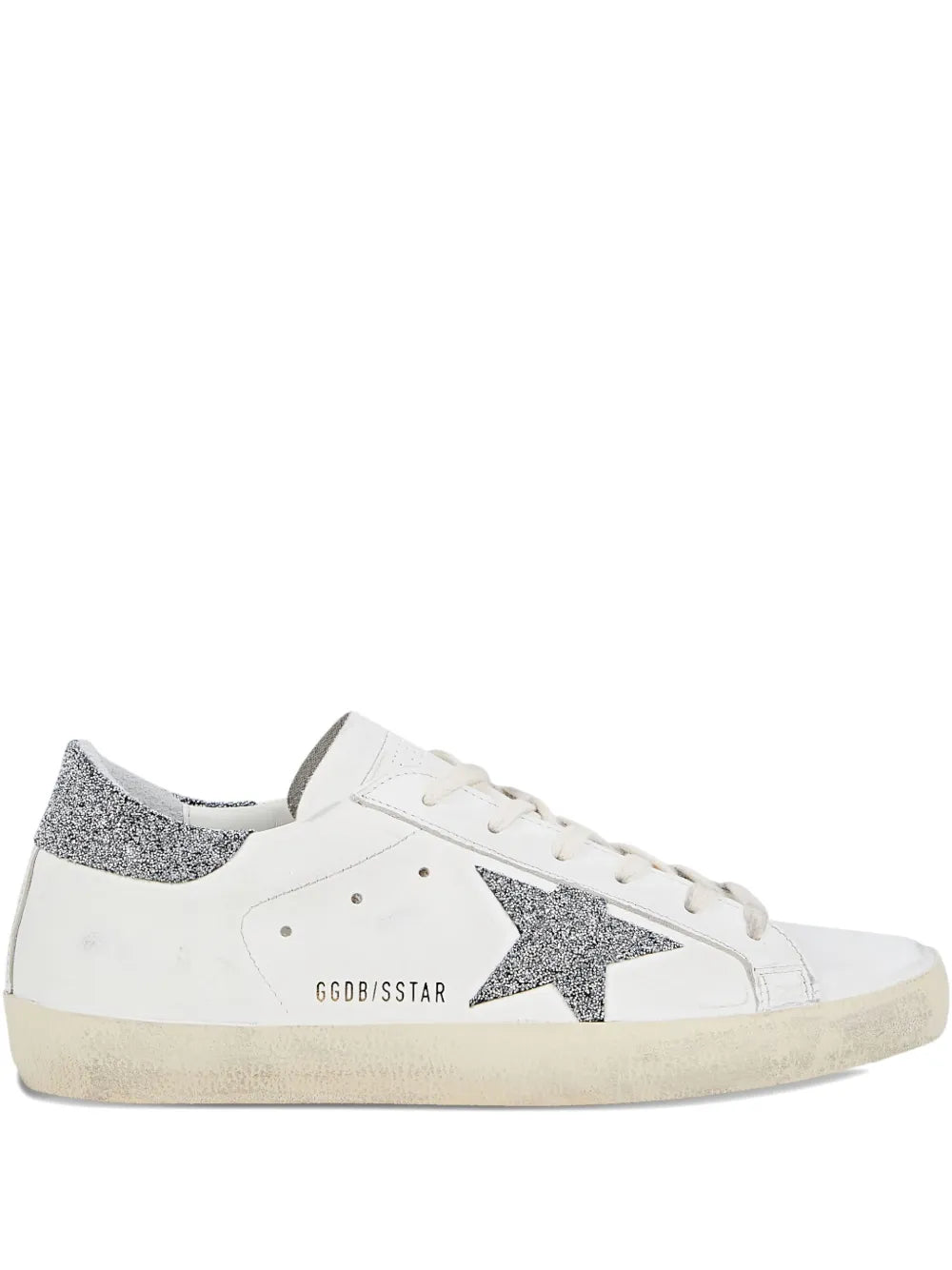 Embellished white sneakers with silver star patch and glitter heel trim