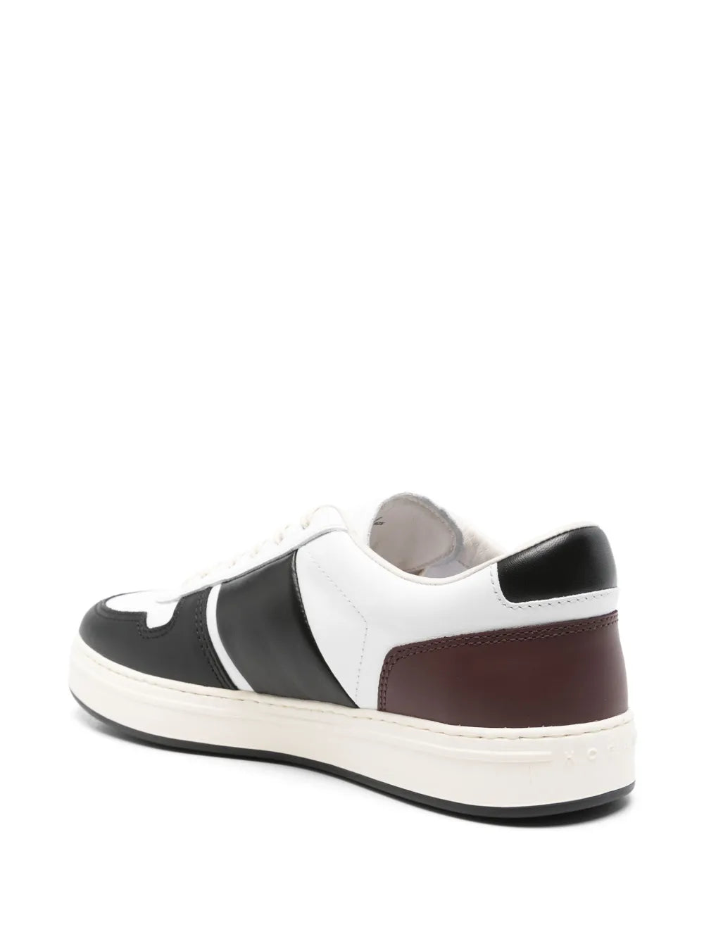 Lace-up sneakers with white upper, black heel tab, and brown rear panel