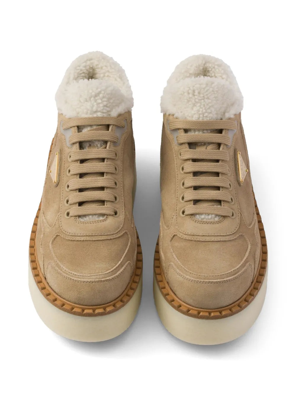 Pair of suede mid-top sneakers with shearling collar and lace-up closure; front view