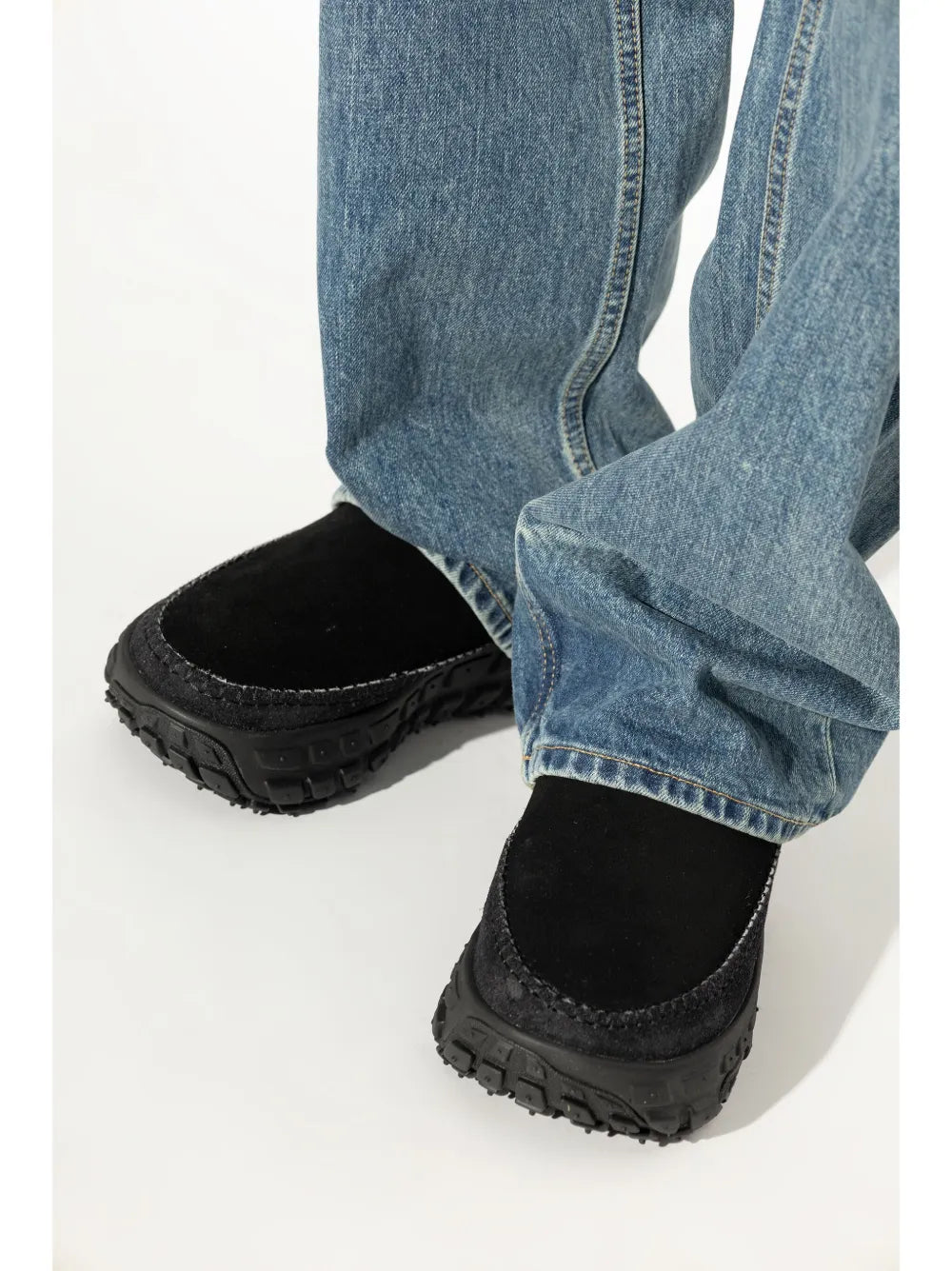 Black UGG Venture Daze slip-on sneakers, close-up view of lugged outsole