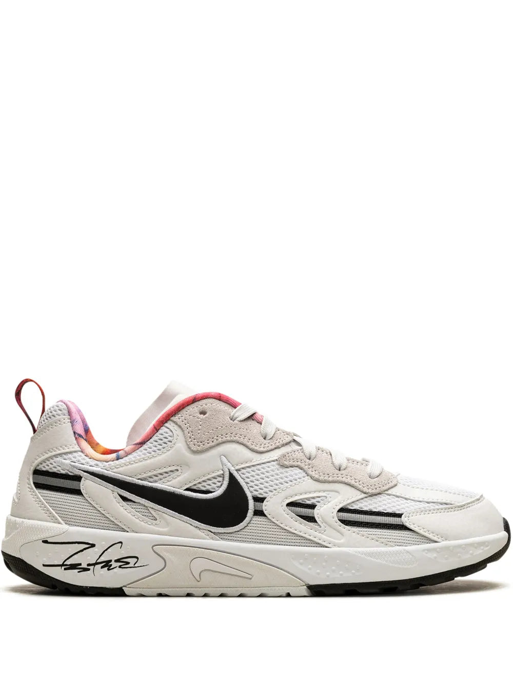 Nike white training sneaker with black swoosh and red-pink accents