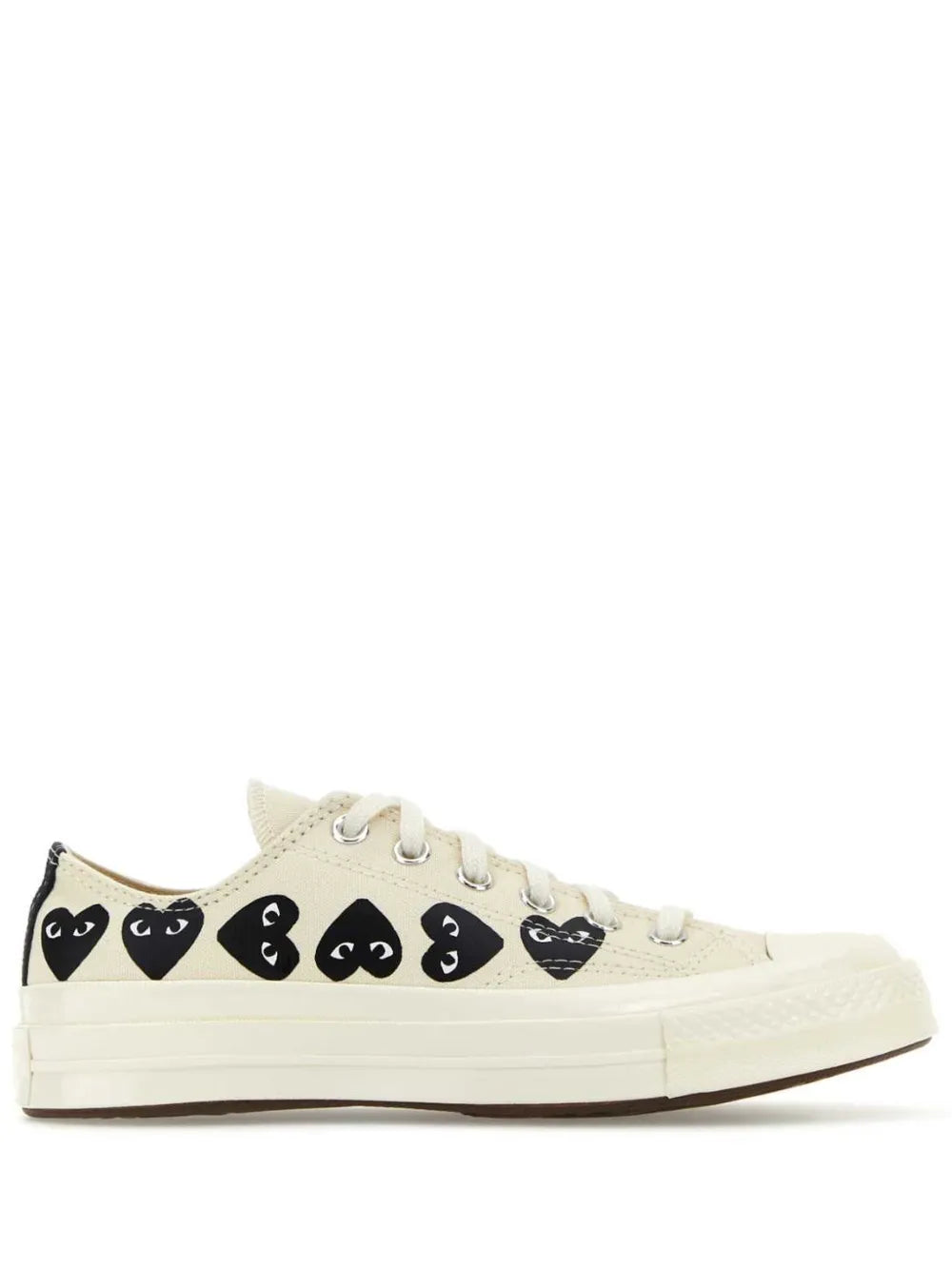 White low-top sneakers with black Play-style face graphics, lace-up, rubber sole