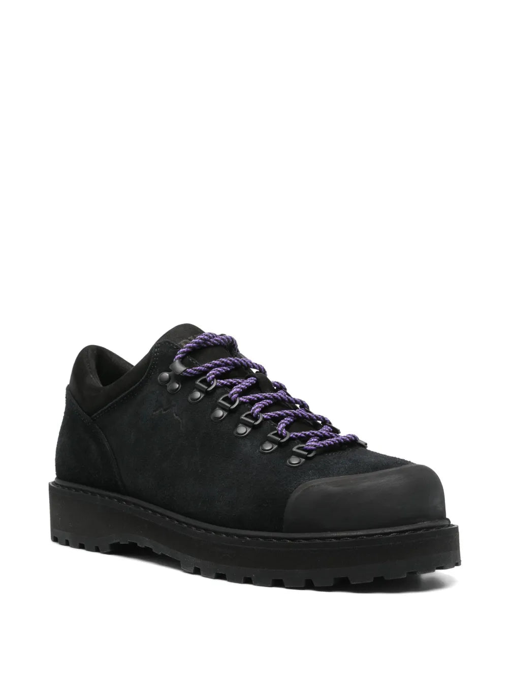 Black low-top lace-up sneakers, purple laces, chunky lug rubber sole.