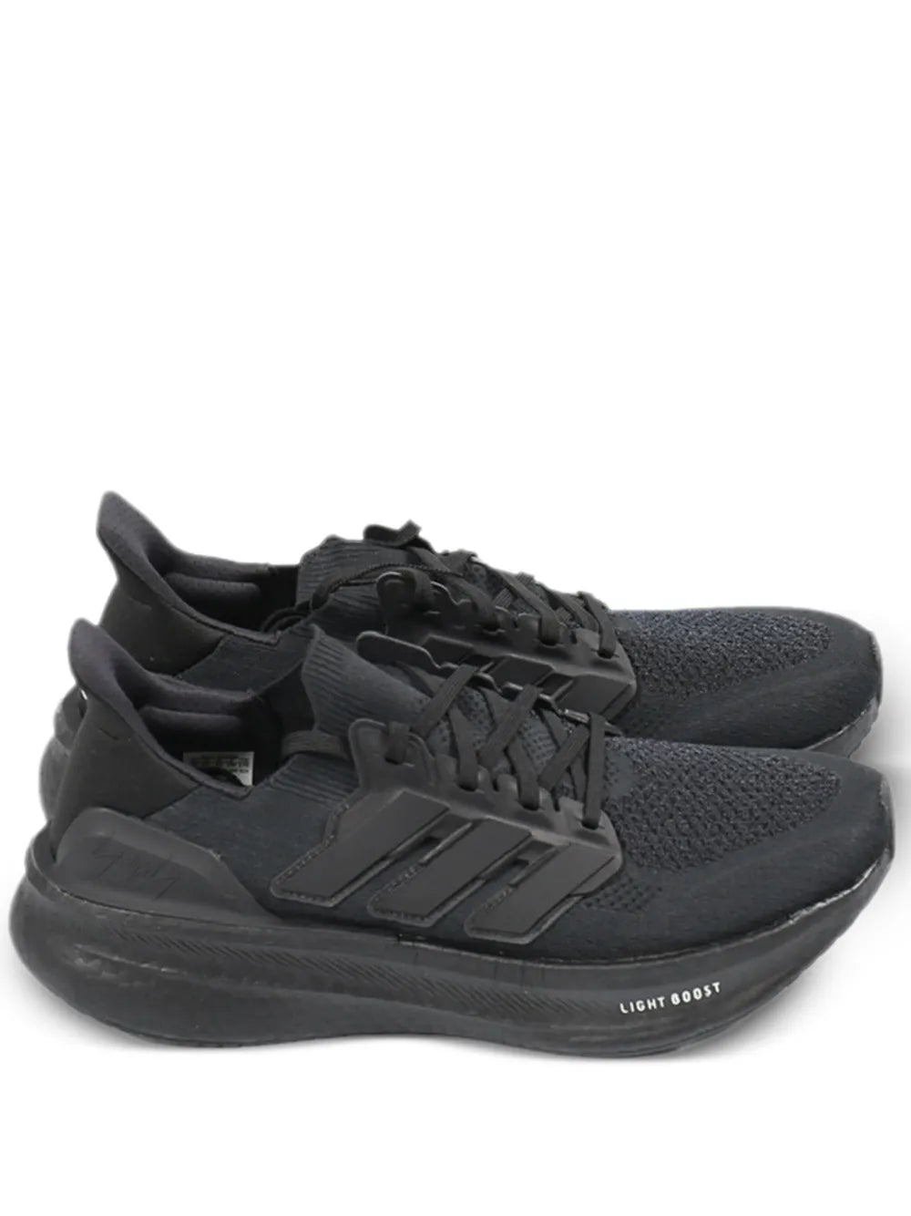 Black lace-up running shoes with knit upper and Boost midsole