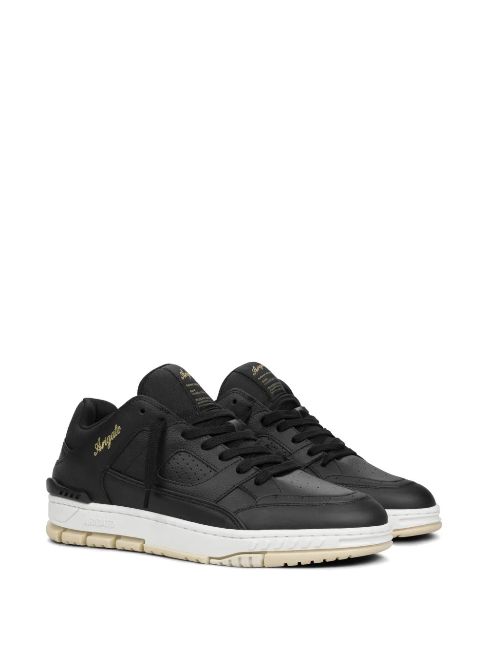 Black low-top sneakers, lace-up style, gold logo detailing and cushioned sole