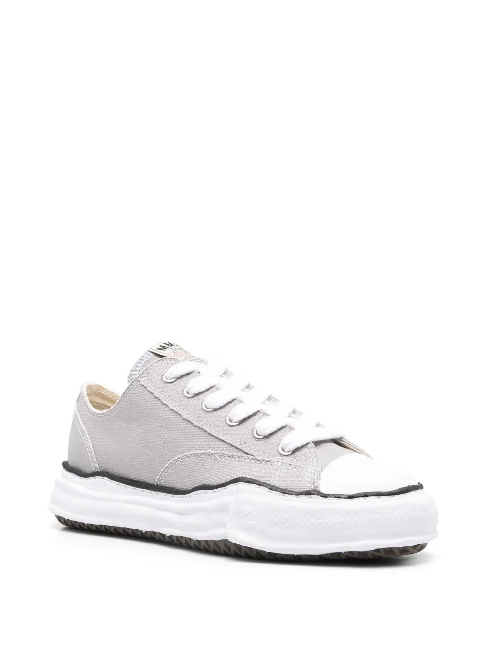 Light grey low-top sneakers with white laces and chunky rubber sole, side view