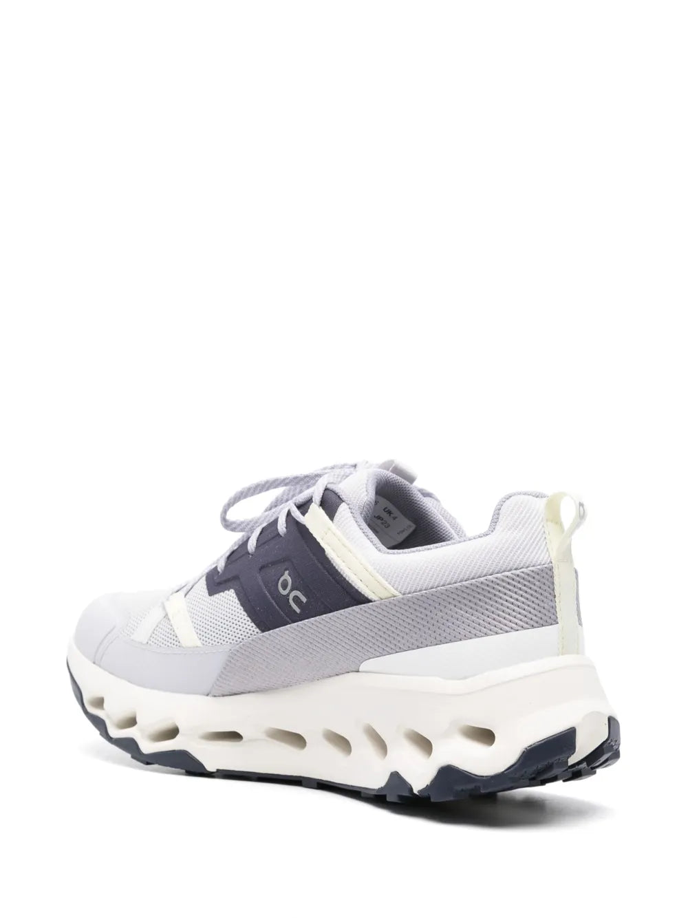 White and gray running sneaker with side panel accents and cloud pod tread outsole