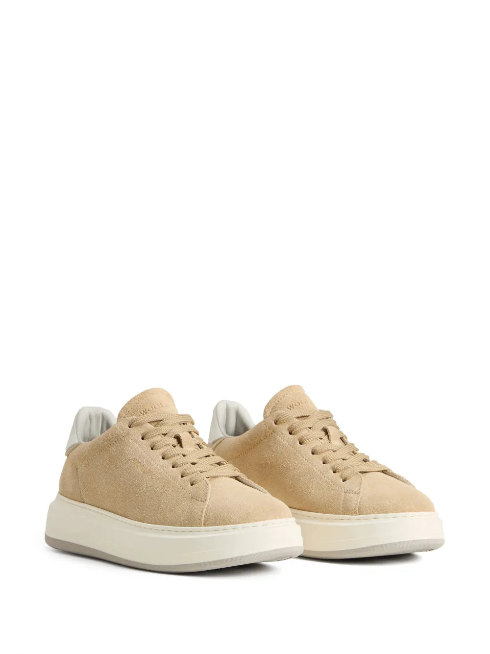 Beige suede low-top sneakers, side view, with lace-up and white sole
