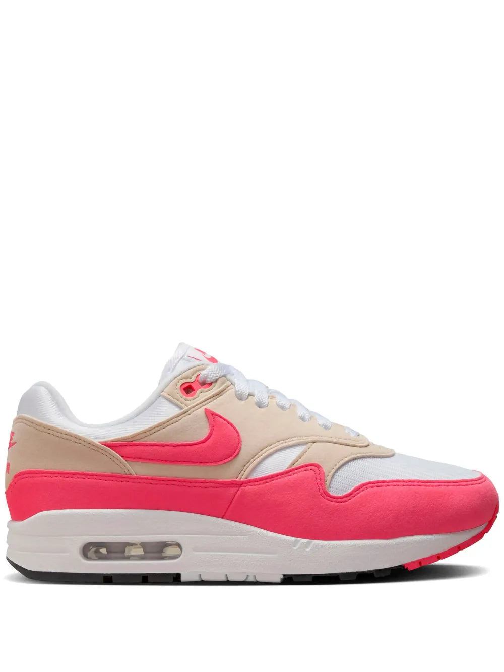 Nike Air Max 1 sneaker in pink and beige with white laces and visible air unit