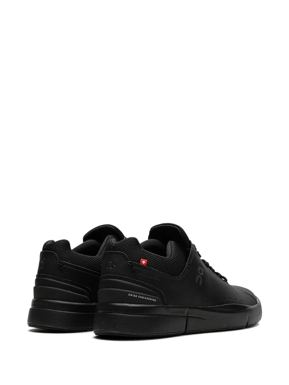 Black low-top lace-up sneaker, heel and back view with small pull tab