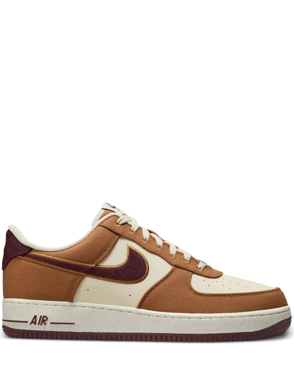 Nike Air Force 1 low sneakers in light tan with white toe and burgundy swoosh, lace-up