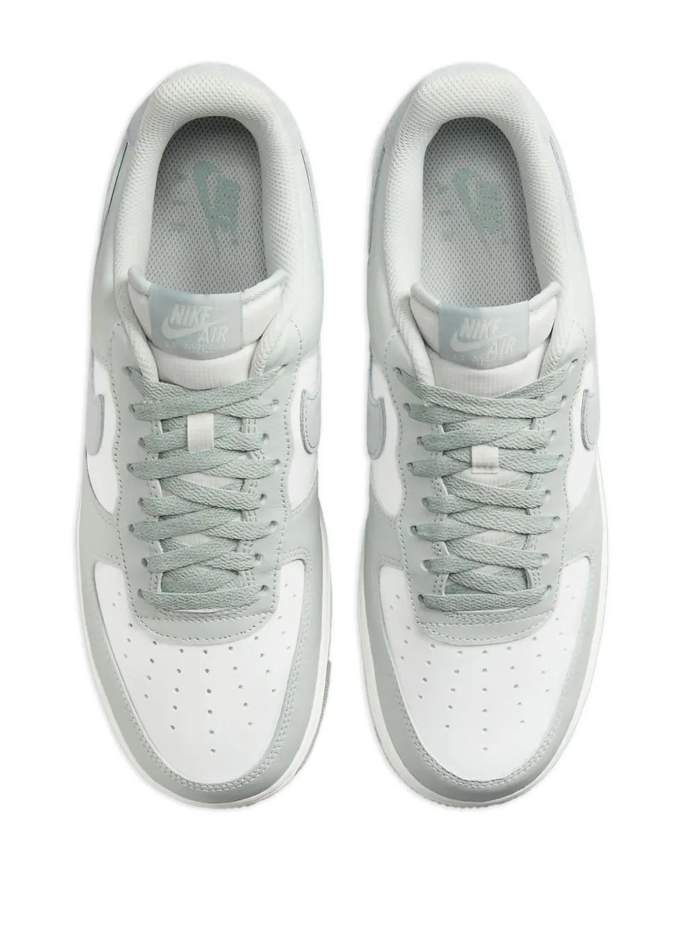 Nike Air Force 1 sneakers pair, light grey laces on white leather with padded tongue