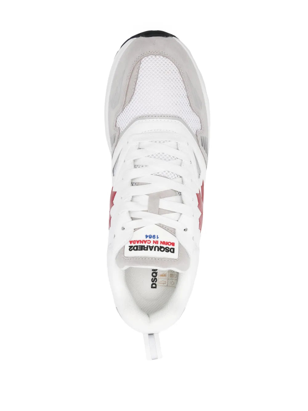 White sneakers toe and lace view with red maple leaf detail on the side