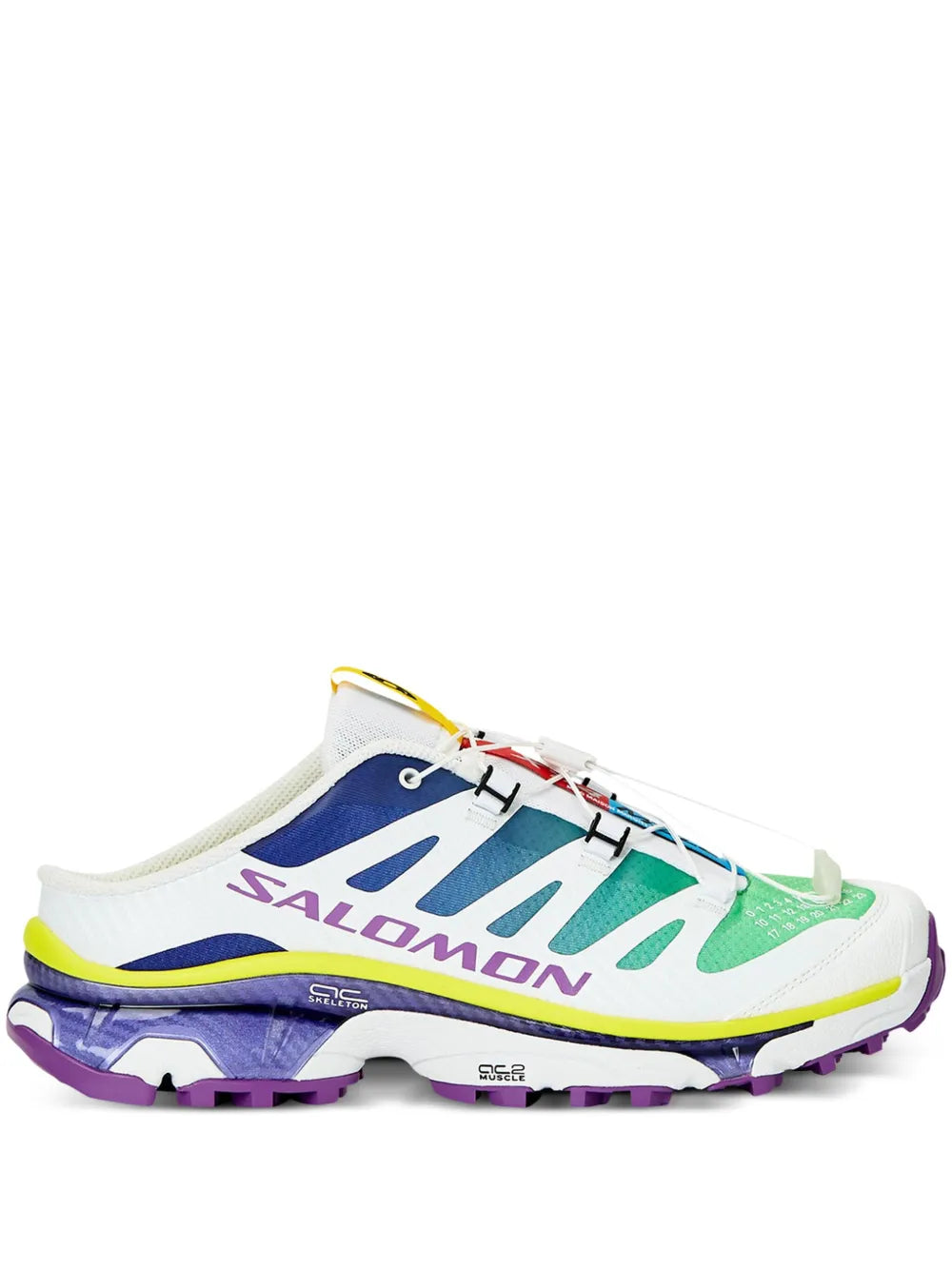 White and blue slip-on sneaker with colorful logo straps and chunky purple sole