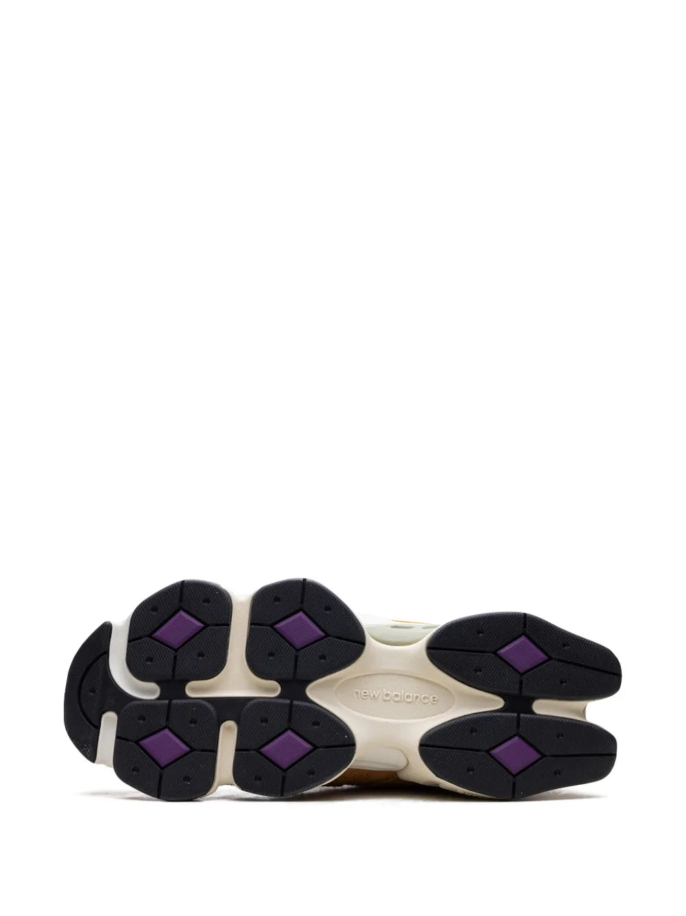 New Balance 9060 sneakers outsole, black traction pods with purple geometric inserts