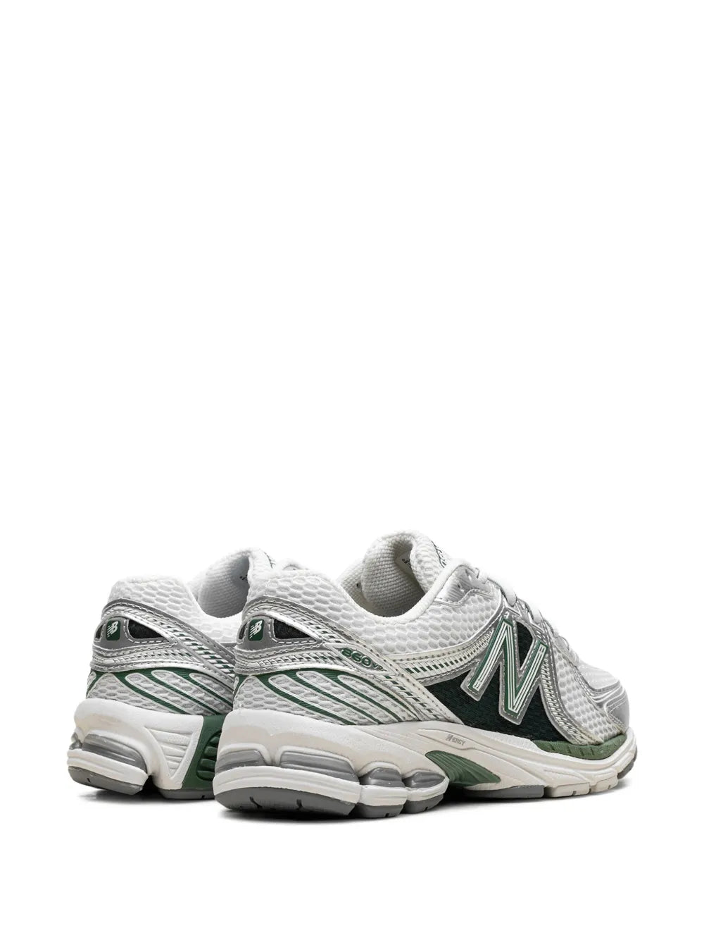 New Balance 860V2 sneakers, side view with white uppers and green heel trim